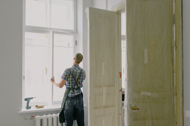 person installing a window
